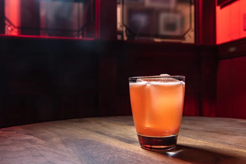 Bar advertising frame with cocktail and backbar context