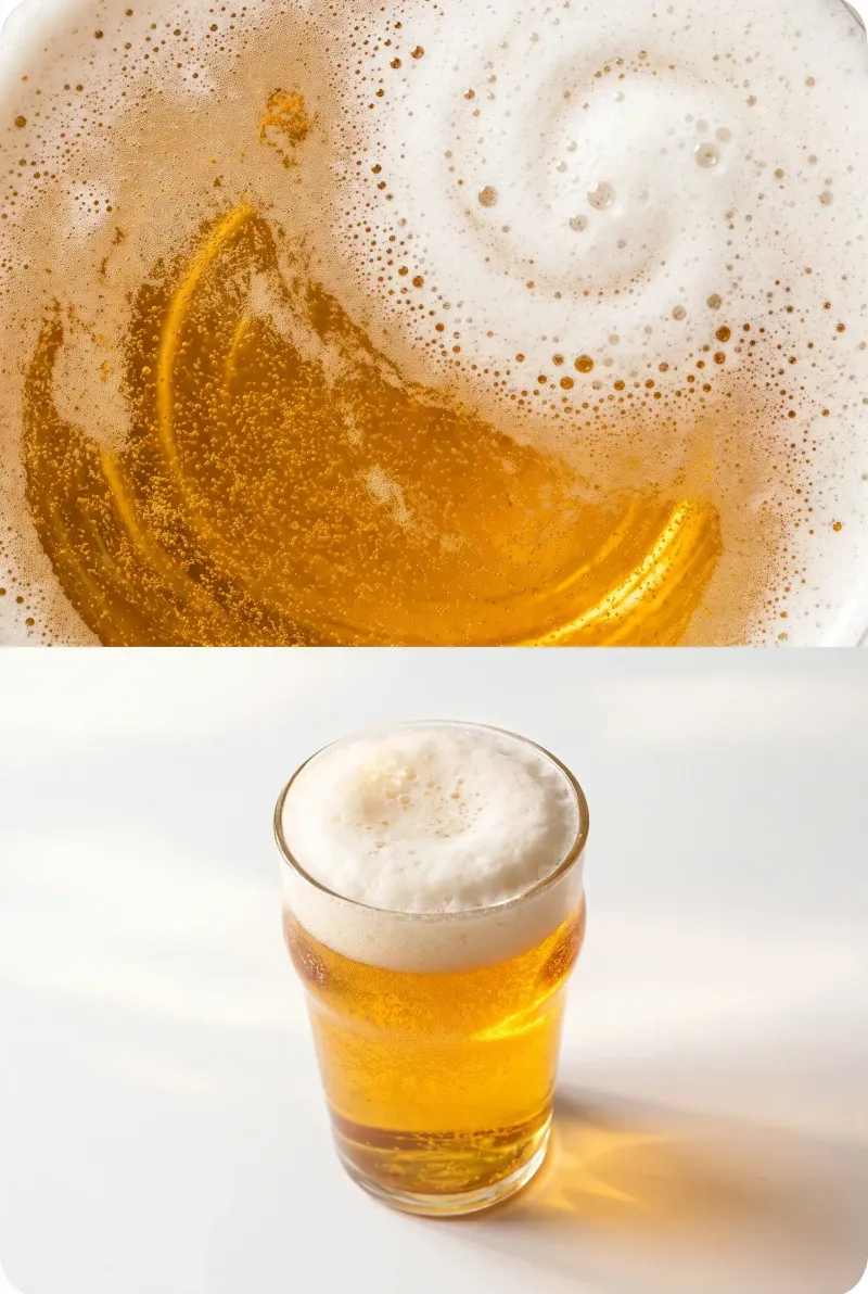 Top-down beer surface with foam beside a golden lager glass, studio beer photography
