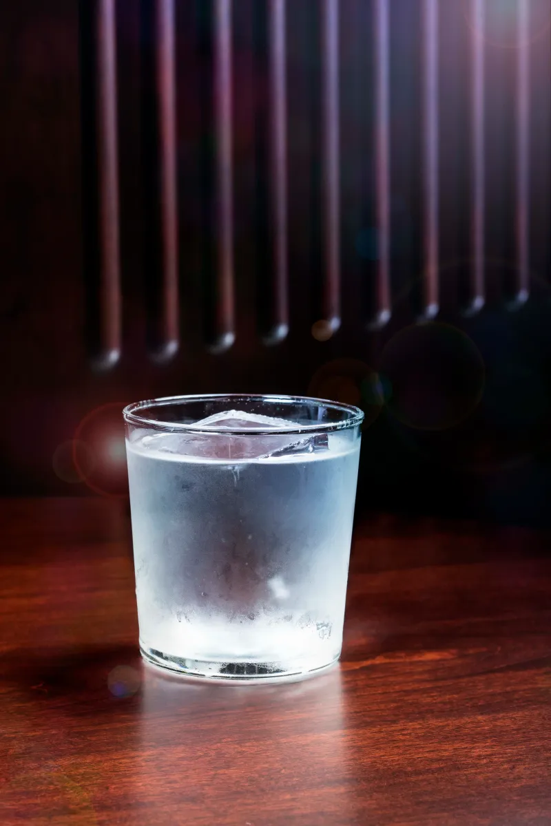BlackTail old fashioned cocktail in moody bar lighting