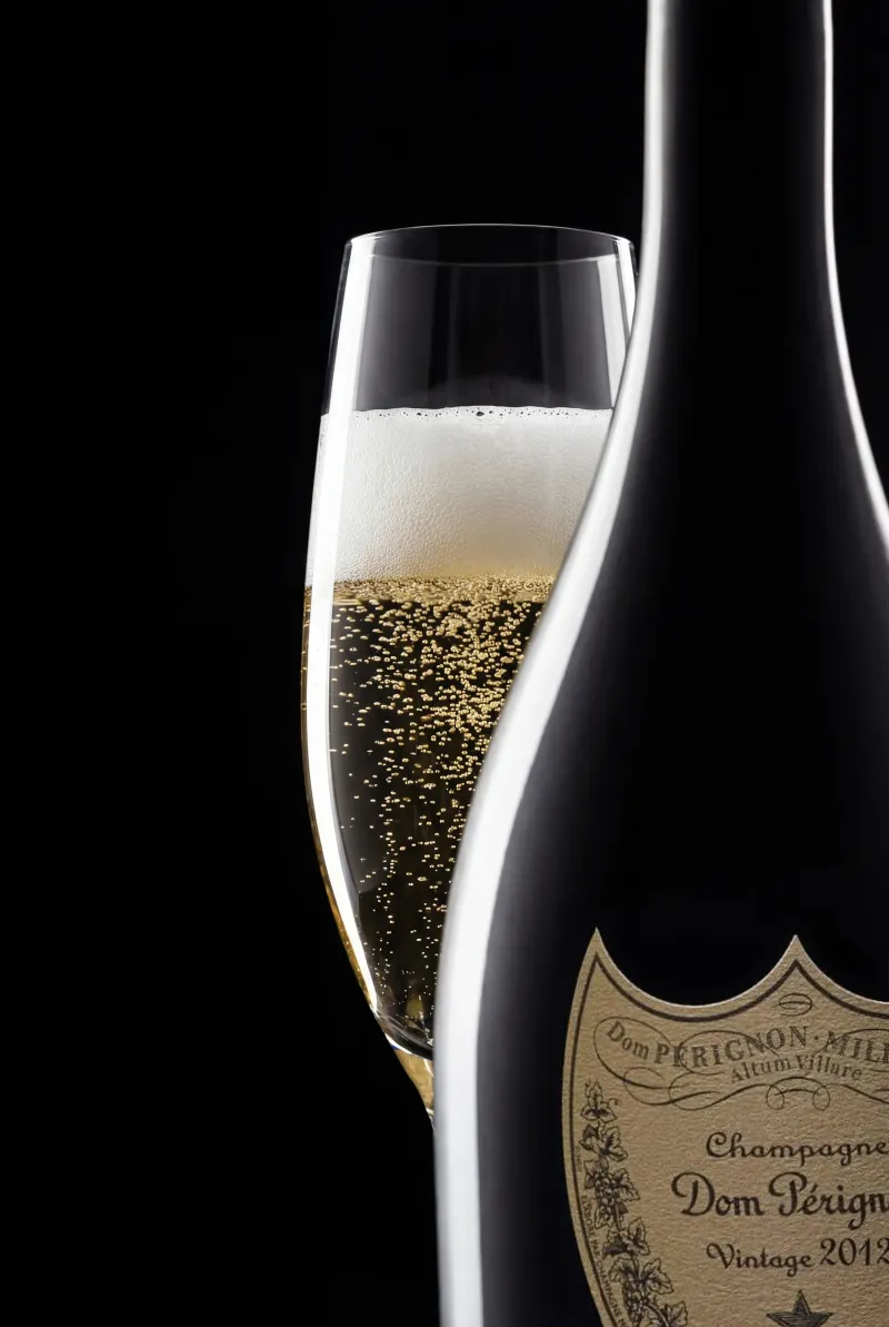 Champagne bottle hero with controlled highlights, sparkling wine