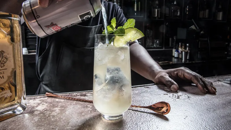 Bartender building a Dark and Stormy with HH Bespoke Spirits at the bar