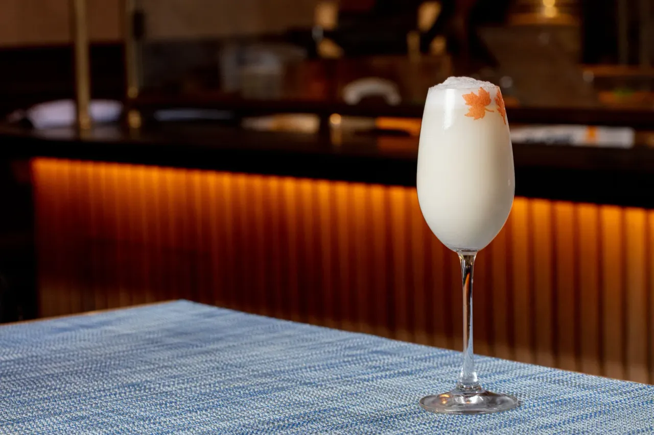 Bar and hospitality photography interior, warm ambient lighting and layered composition