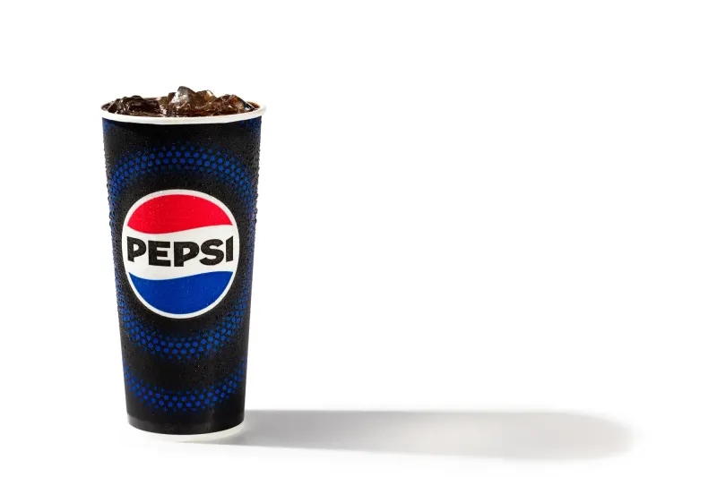 Pepsi fountain cup beaded with condensation on white, stadium concession packshot