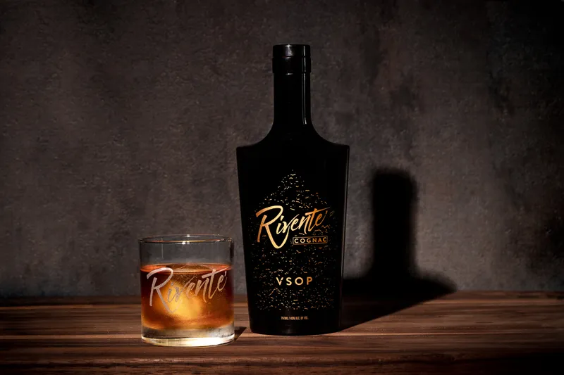 Rivente cognac bottle, label-accurate packshot on white