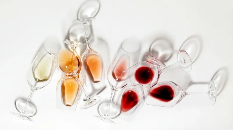 Wine glass resting on its side, editorial wine composition