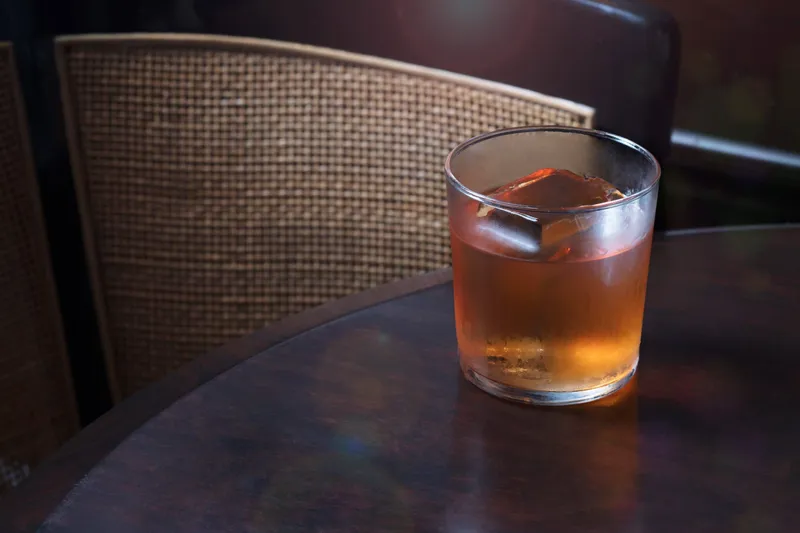 Cocktail lit to show controlled highlights and garnish detail