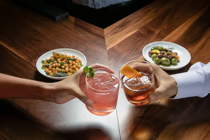 Festive winter cocktail with seasonal garnish, commercial drinks photography