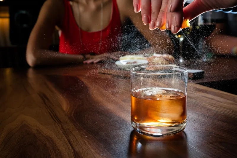 Spring cocktail advertising photograph with seasonal garnish